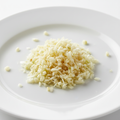 Fresh garlic cloves minced on white background
