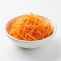 Fresh carrot shredded on white background
