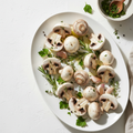 Fresh mushrooms large quartered on white background