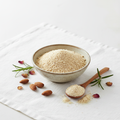 Almond meal powder in bowl on white background